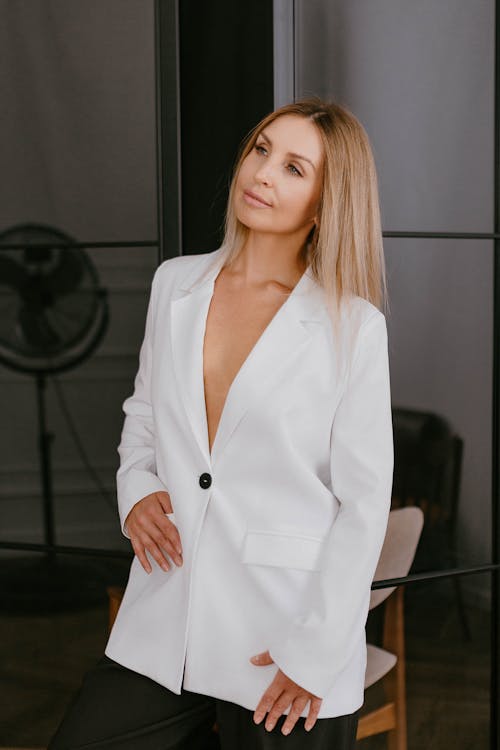Studio Shot of an Elegant Woman in a White Blazer 