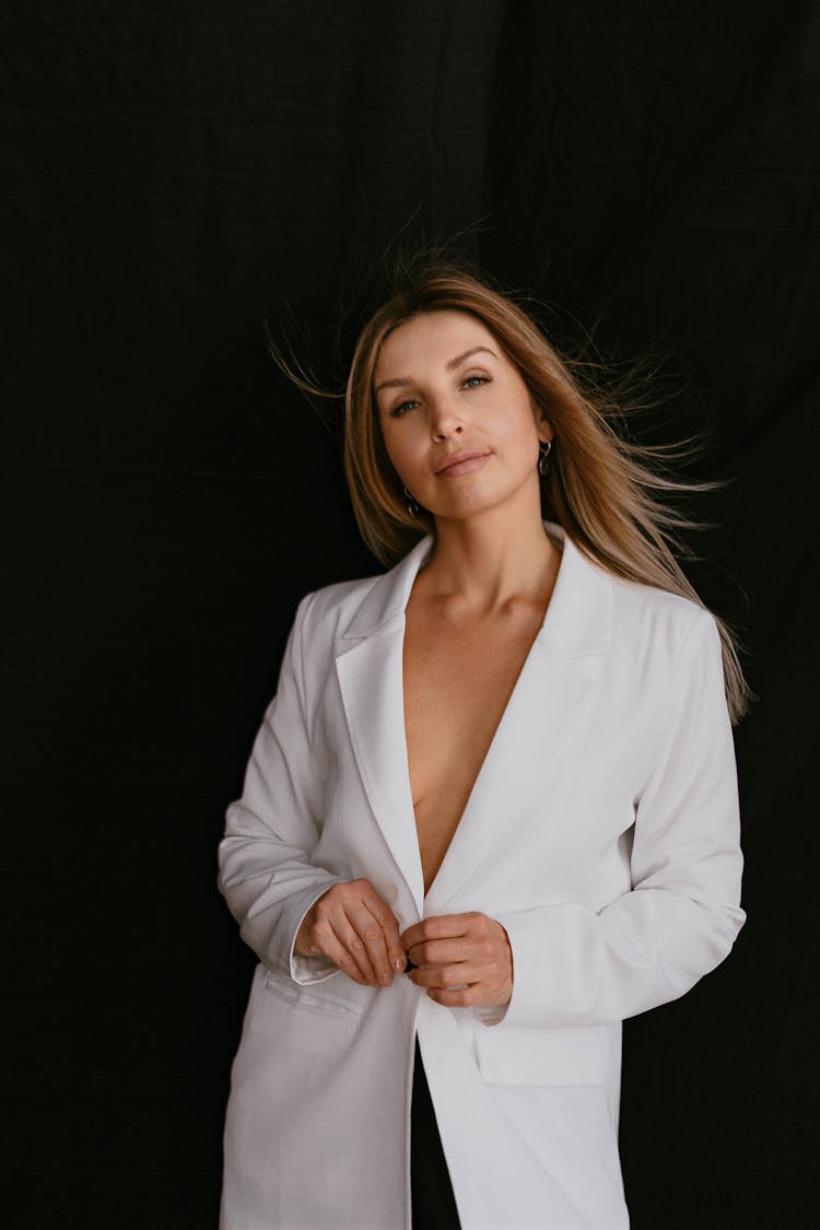 Blonde Woman Posing In White Blazer