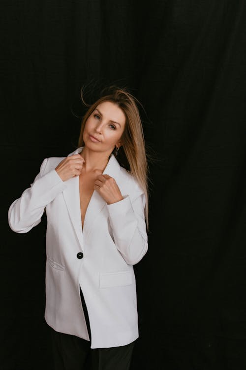 Studio Shot of an Elegant Woman in a White Blazer 