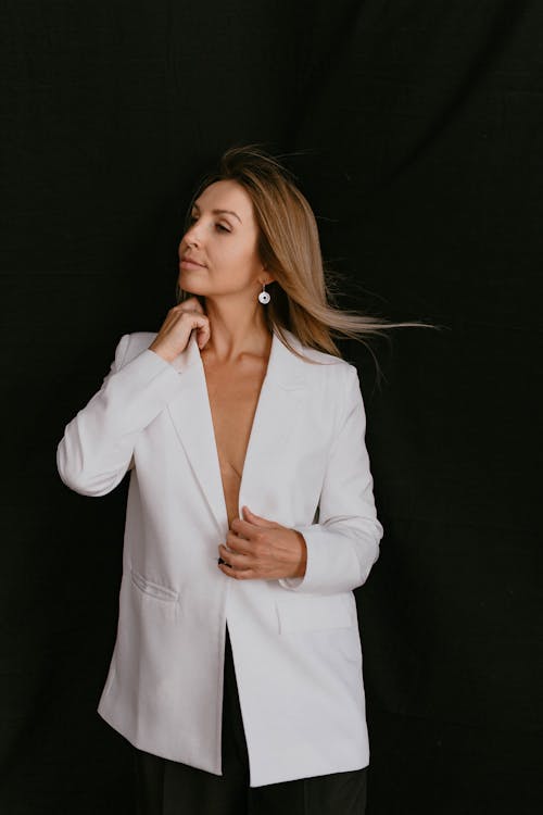 Studio Shot of an Elegant Woman in a White Blazer 