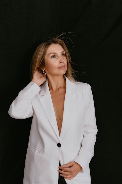Studio Shot of an Elegant Woman in a White Blazer 