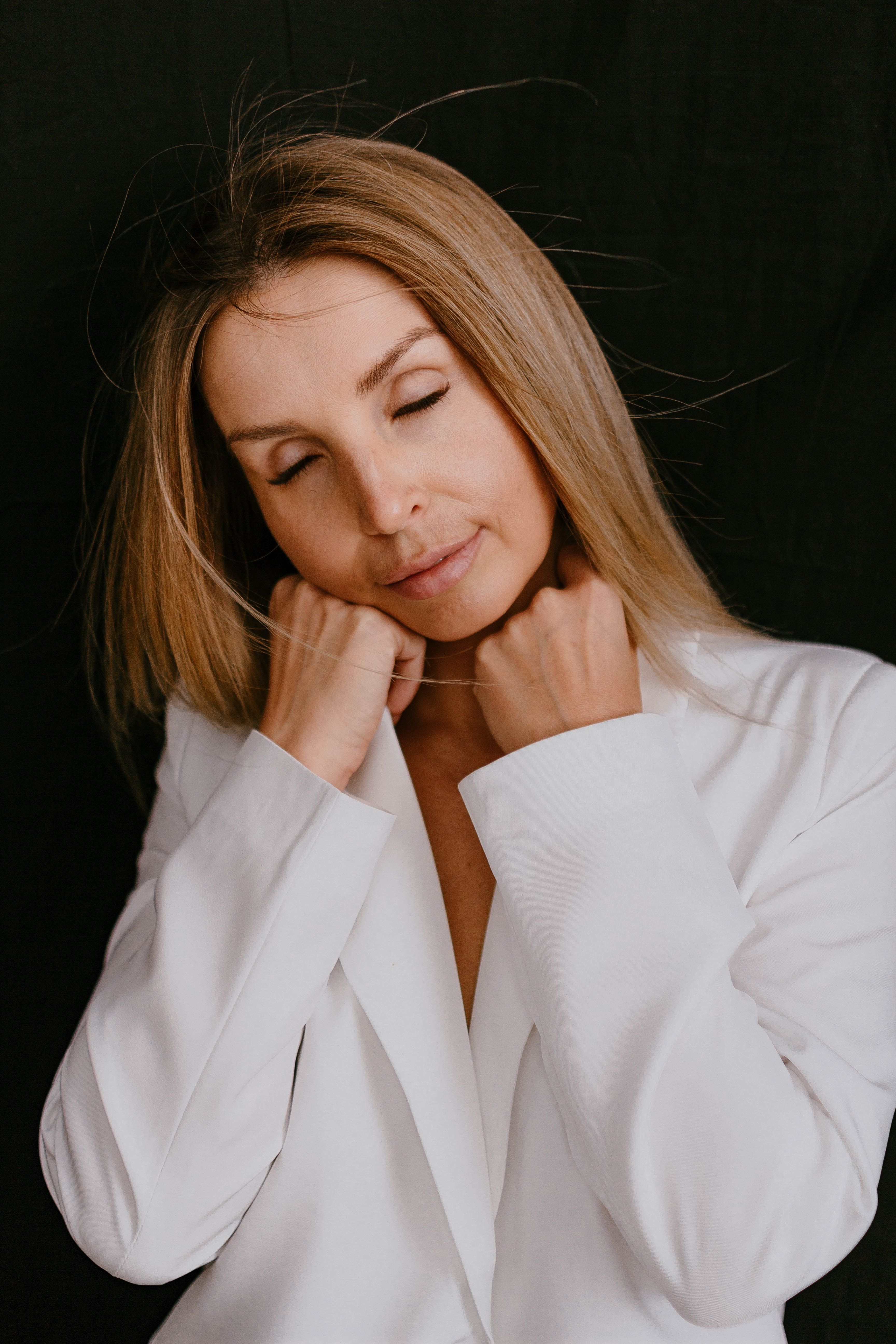 Studio Shot of an Elegant Woman in a White Blazer · Free Stock Photo