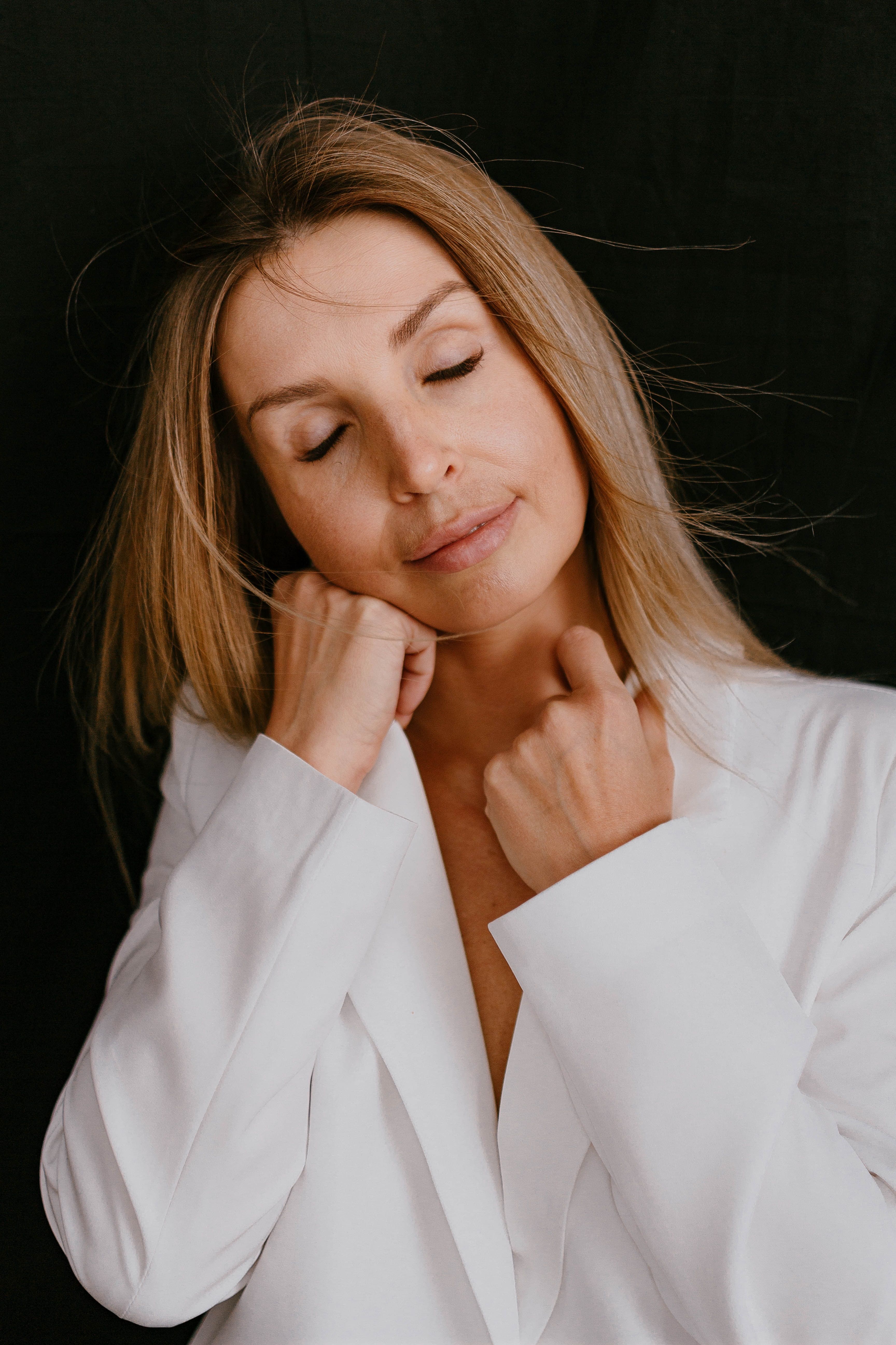 Studio Shot of an Elegant Woman in a White Blazer · Free Stock Photo