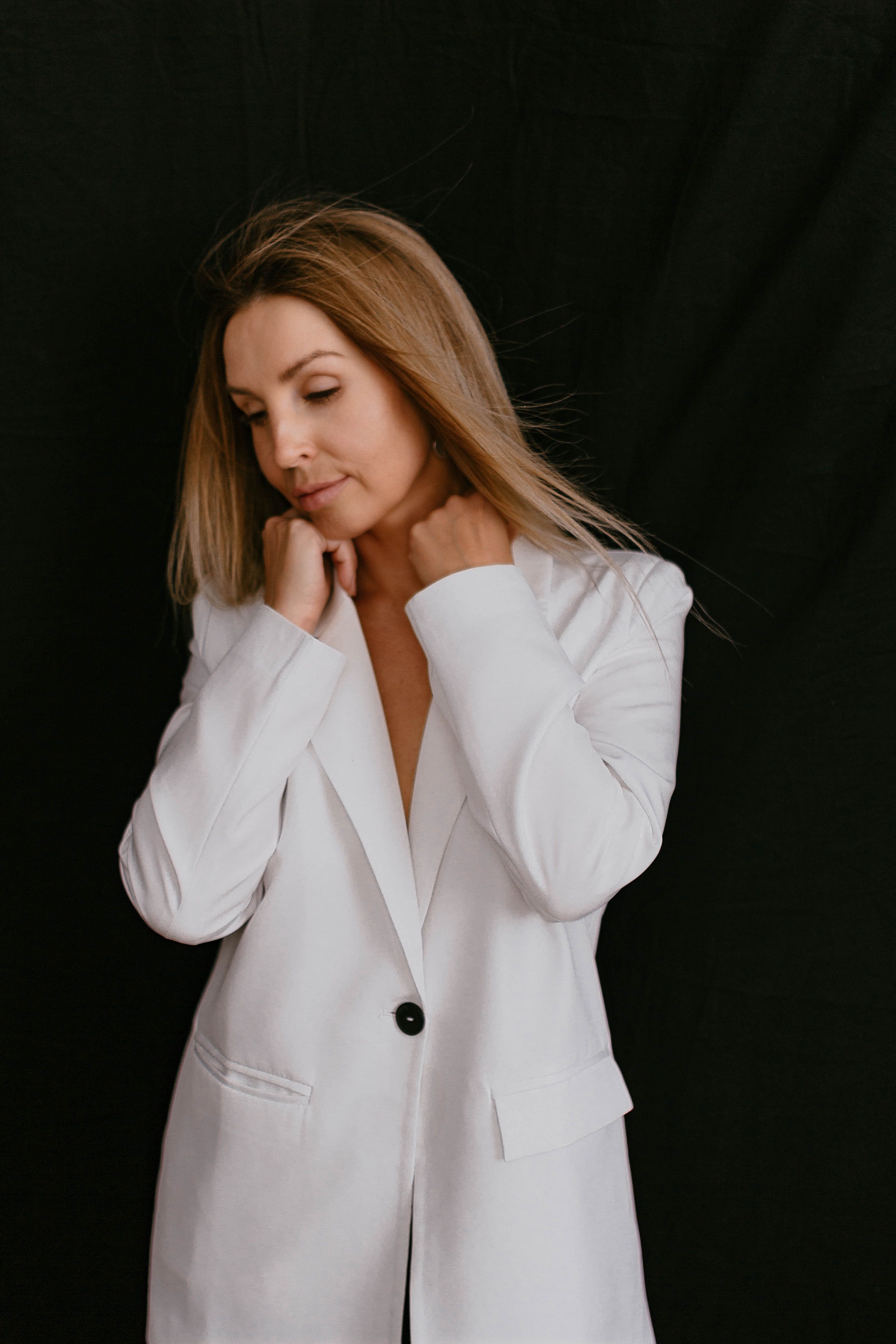 Studio Shot of an Elegant Woman in a White Blazer · Free Stock Photo