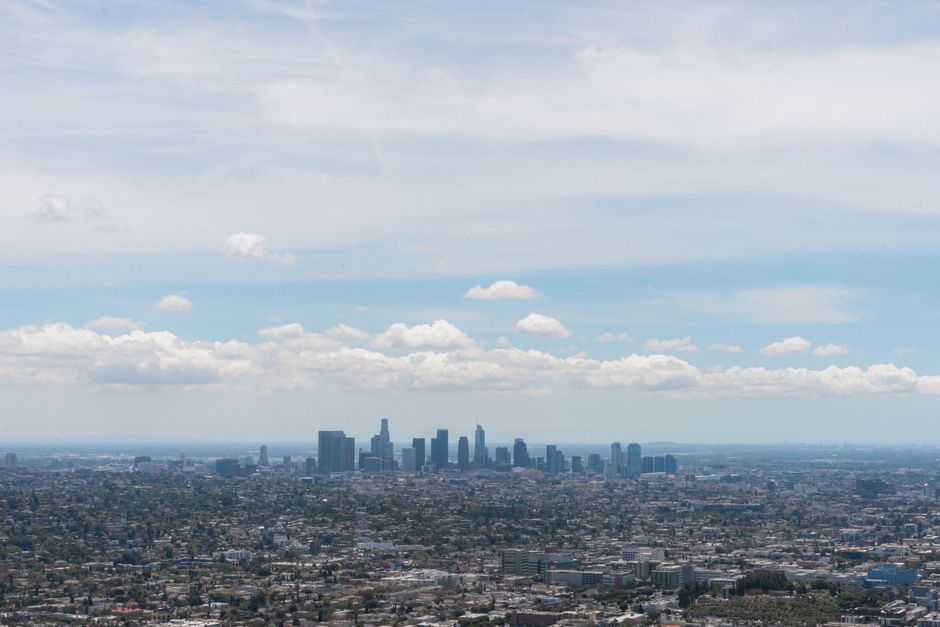 Spectacular Private Helicopter Tour over Long Beach: See Catalina, Queen Mary Review Review 2026 - A stunning aerial view of the Los Angeles skyline under a clear blue sky.