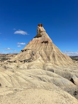 Iconic erosion landscape of Castildetierra in Bardenas Reales, Navarre, Spain under clear blue sky.