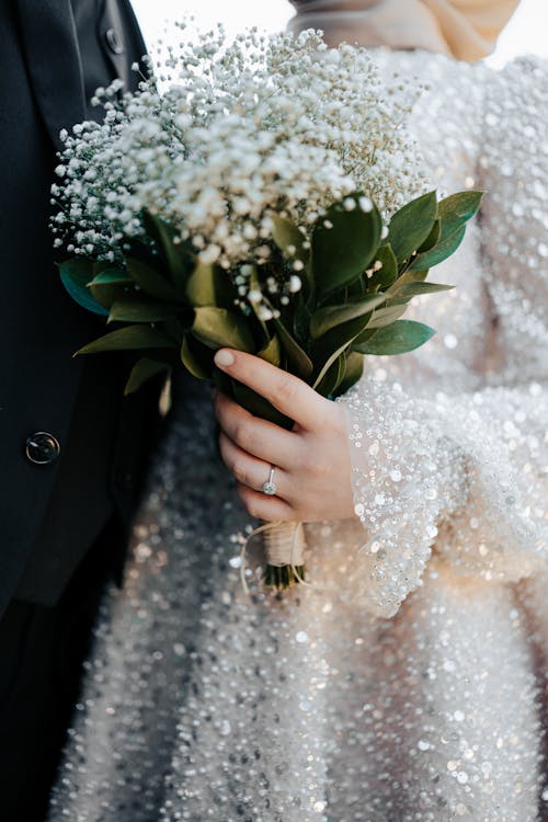 Bride Holding a Bouquet of Flowers 