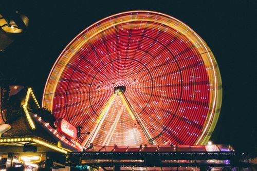 Free Dazzling Ferris wheel illuminated at night, showcasing vibrant lights at a festival in Dortmund, Germany. Stock Photo