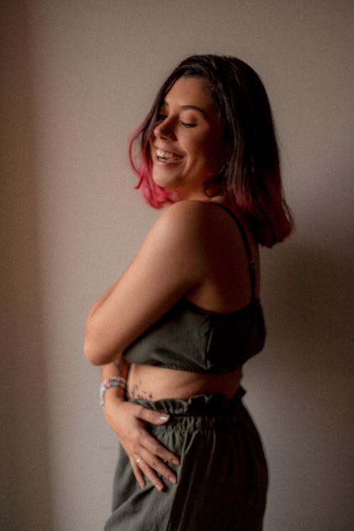 Young Woman with Dyed Hair Standing and Smiling 