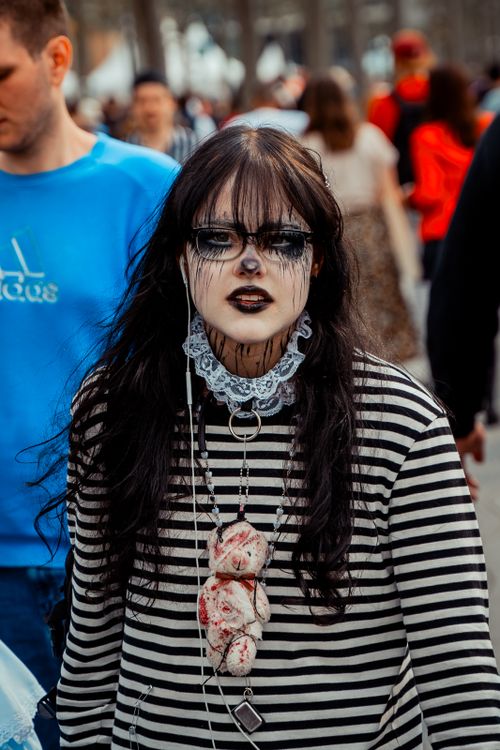 Free Festival attendee in gothic costume with painted face, Düsseldorf, Germany, capturing urban cultural vibes. Stock Photo
