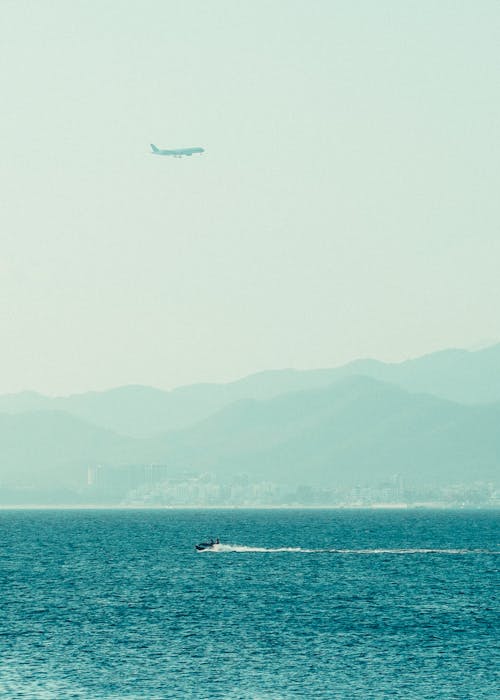 Airplane over Blue Sea