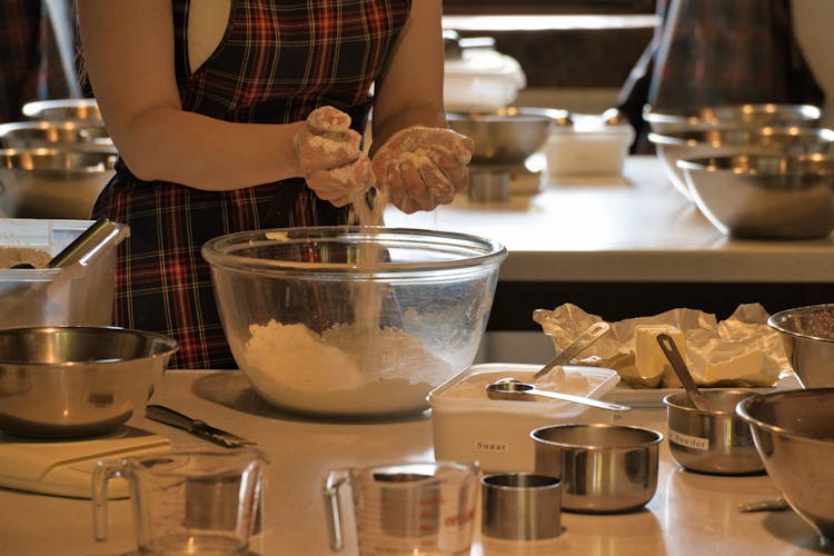 Close-up Of Woman Preparing A Dough At A Cooking Class