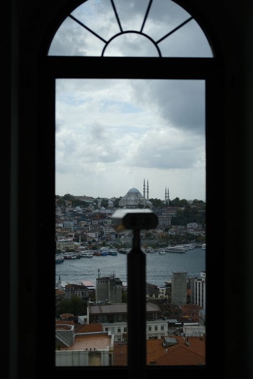 Free Capture of Istanbul skyline through an arched window, featuring iconic architecture and Bosphorus. Stock Photo