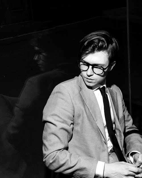 Black and White Shot of a Young Man in a Suit 