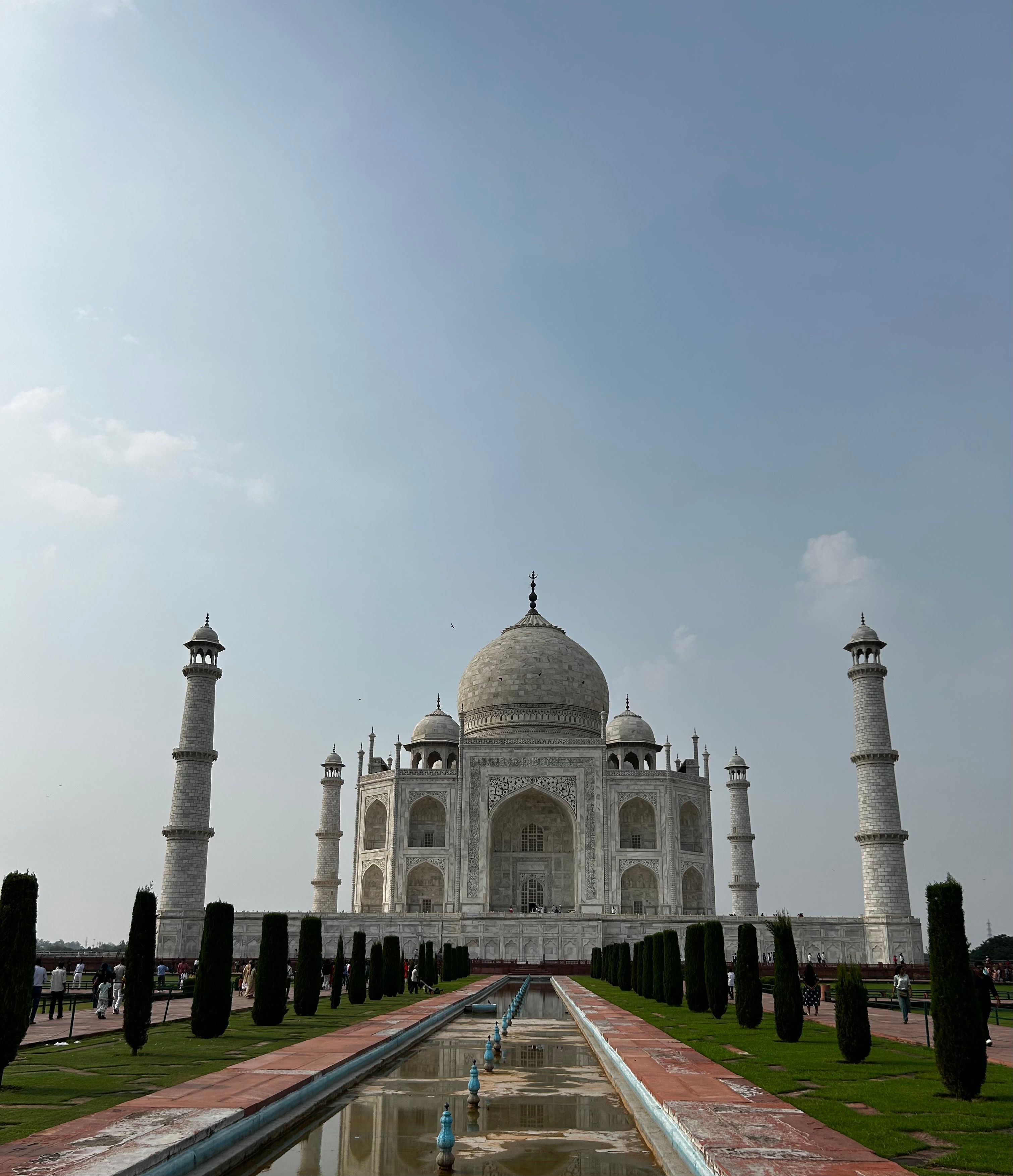 The Taj Mahal in Agra under a clear sky.