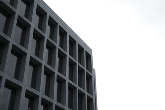 Low angle view of a modern building's facade with grid pattern windows in Istanbul.