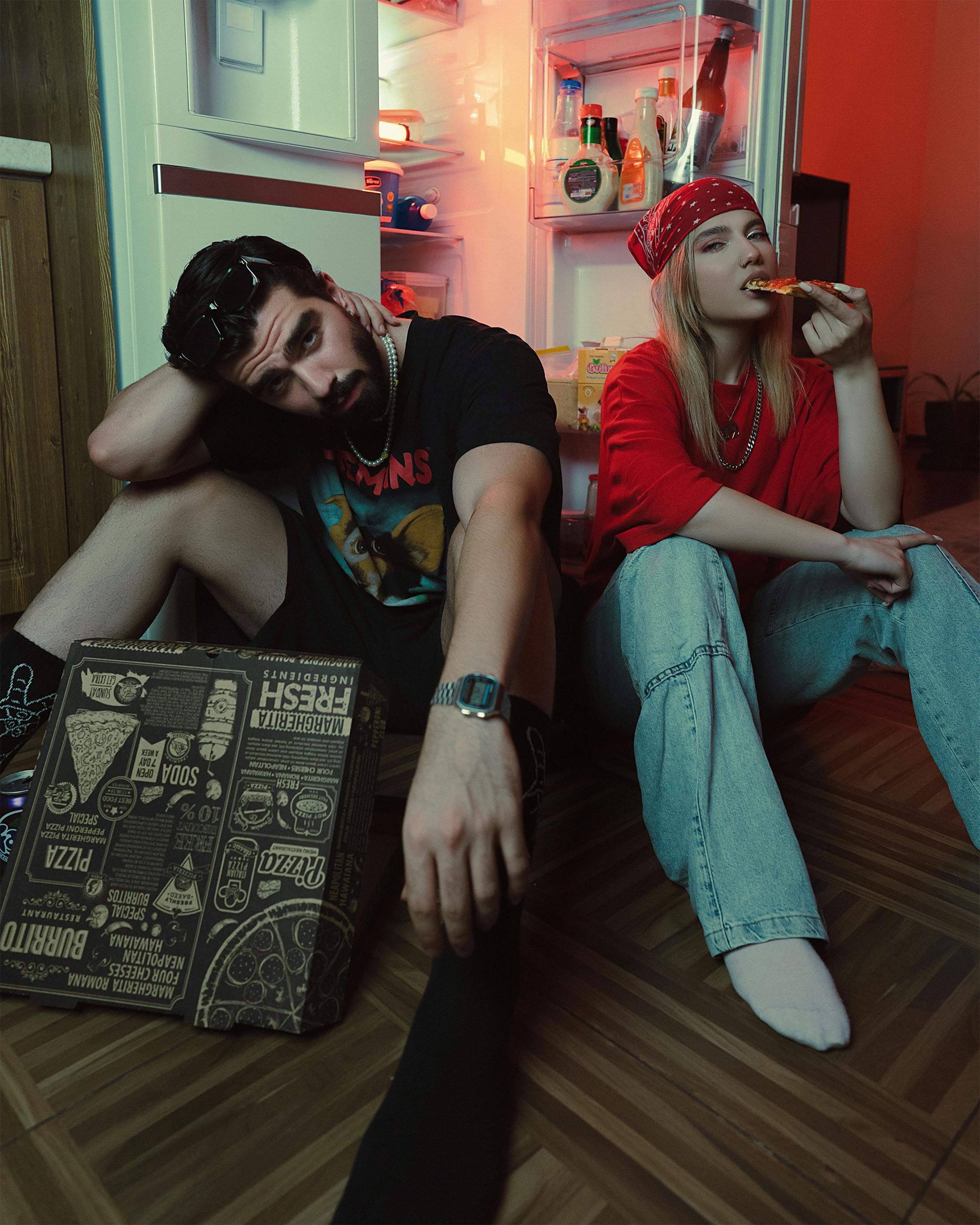 Couple Sitting and Eating Pizza on Floor &middot; Free Stock Photo