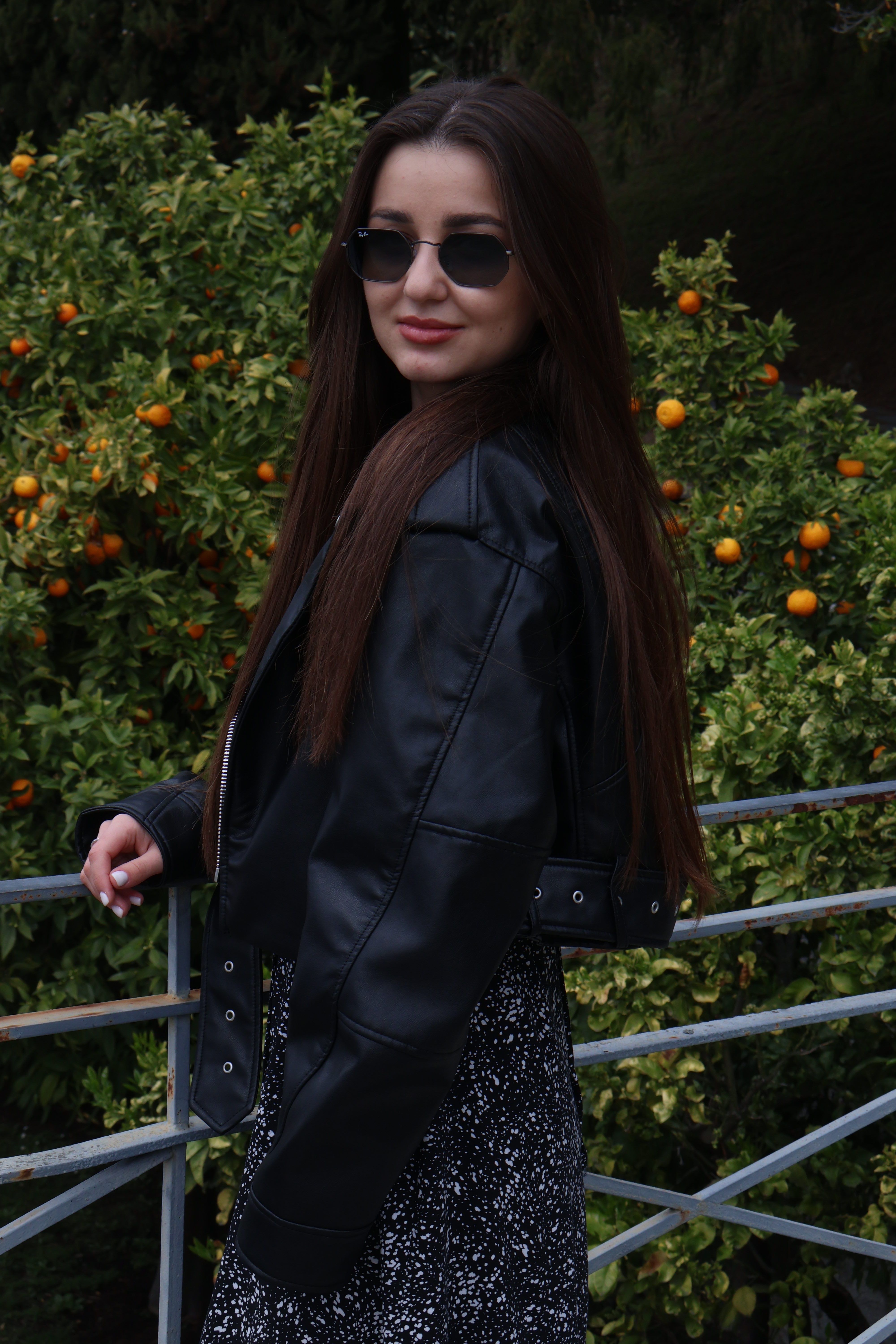 Woman in Sunglasses and Leather Jacket · Free Stock Photo