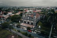Captivating aerial shot of Iglesia de la Inmaculada in Heredia, Costa Rica, with lush surroundings.
