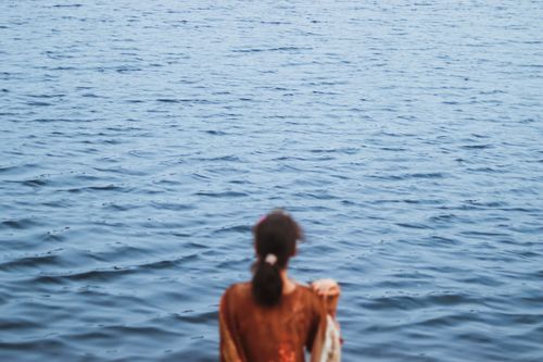 Free A serene moment captured as a woman looks out over calm waters in Chilmari, Bangladesh. Stock Photo