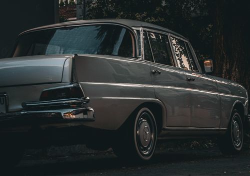 Free Rear view of a classic Mercedes-Benz W110 parked under moody light in Istanbul, Türkiye. Stock Photo