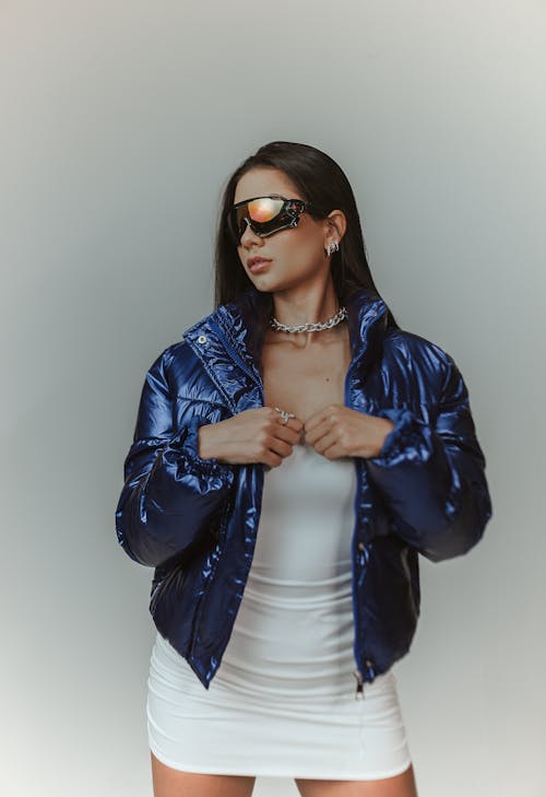 Portrait of Woman in Blue Jacket and Sunglasses