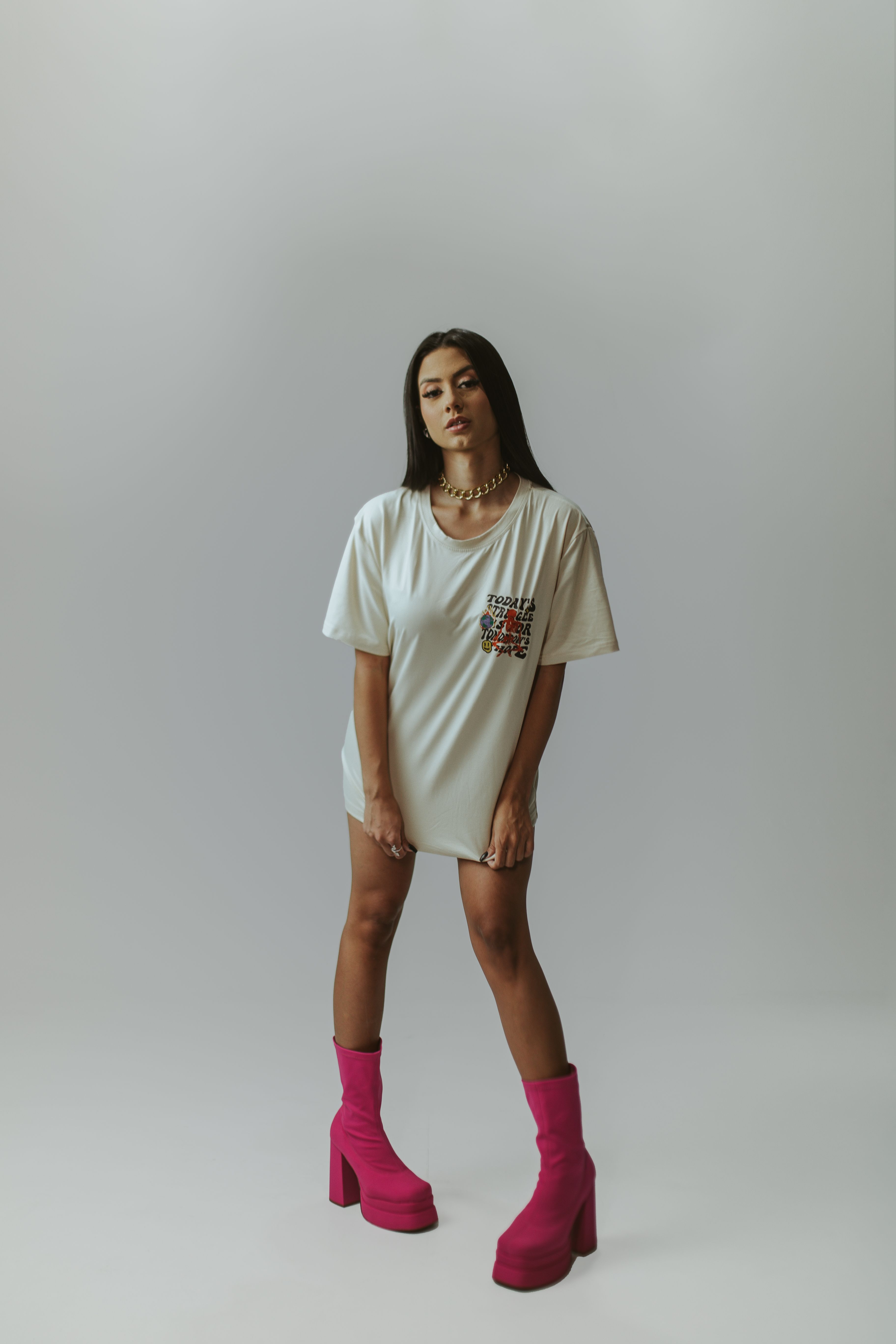 Model wearing an oversized bone-coloured tee dress — photo by Wesley Davi on Pexels