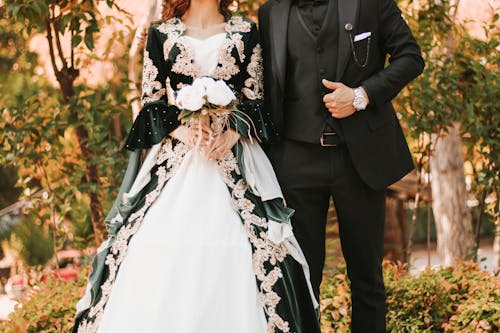 Elegant Bride and Groom Standing Outside