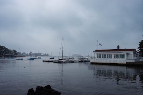 Boats in the Harbor under a Cloudy Sky