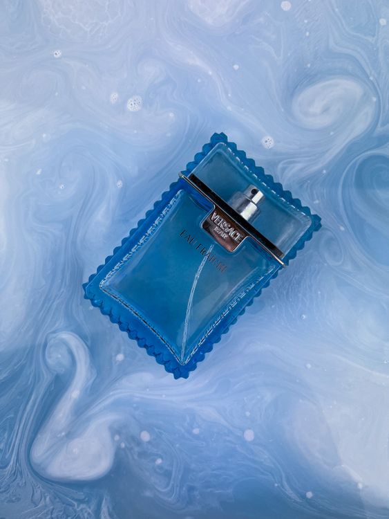 Versace Float A Bottle of Versace Perfume · Free Stock Photo