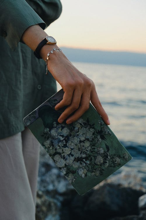 Woman Hand Holding Notebook