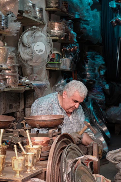 Elderly Man Working in Workshop