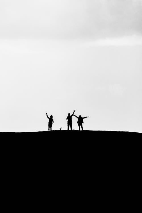 Three People on a Hill 