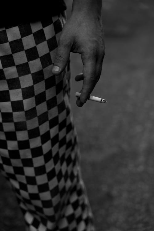 Close up of Hand Holding Cigarette