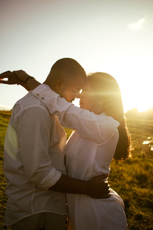 Young Couple Embracing at Sunset 