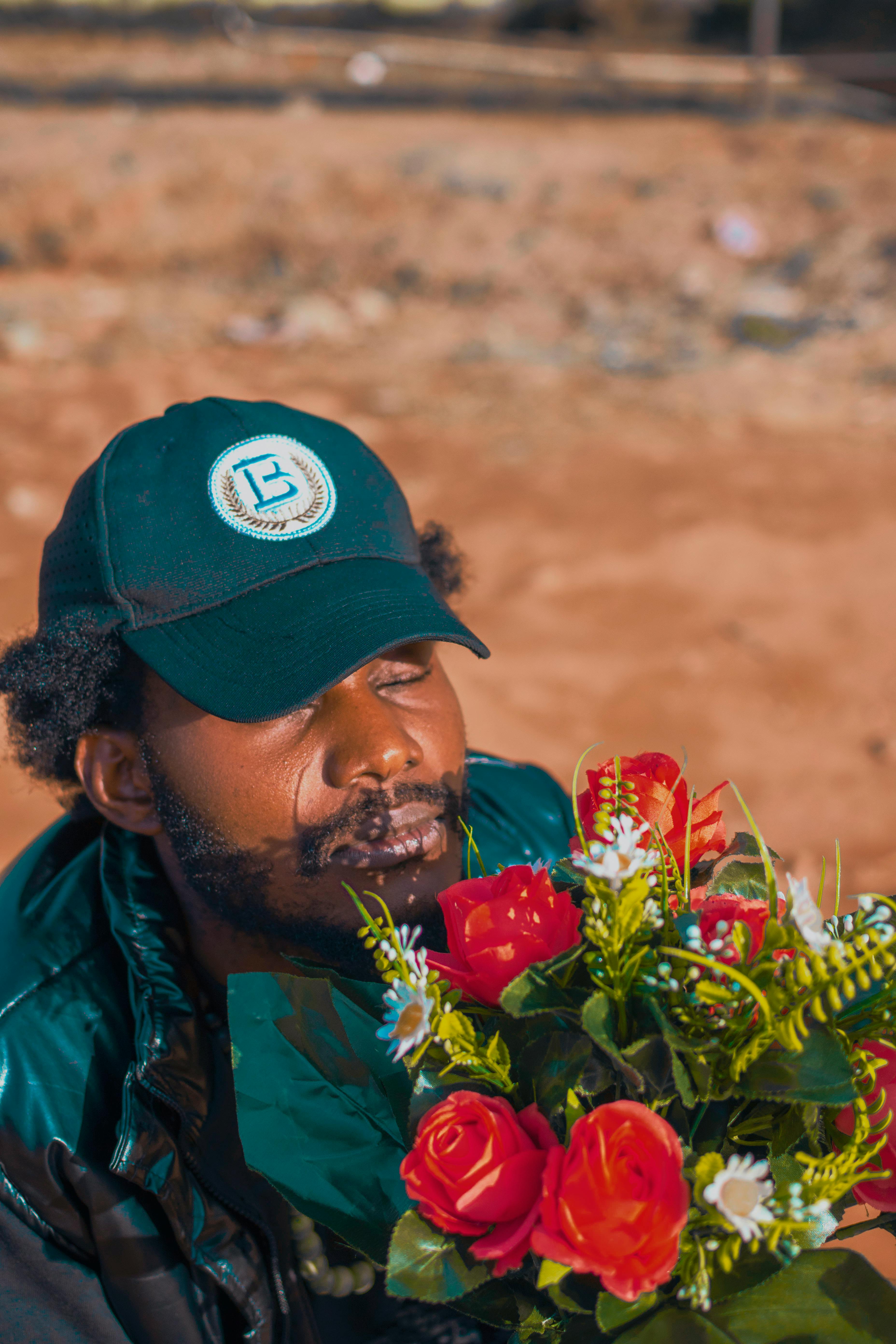 Free Photos - This Stock Photo Depicts Two Men Wearing Hats And Working  Together In A Field, Tending To A Beautiful Field Of Flowers, Likely Roses.  They Are Using A Plow To