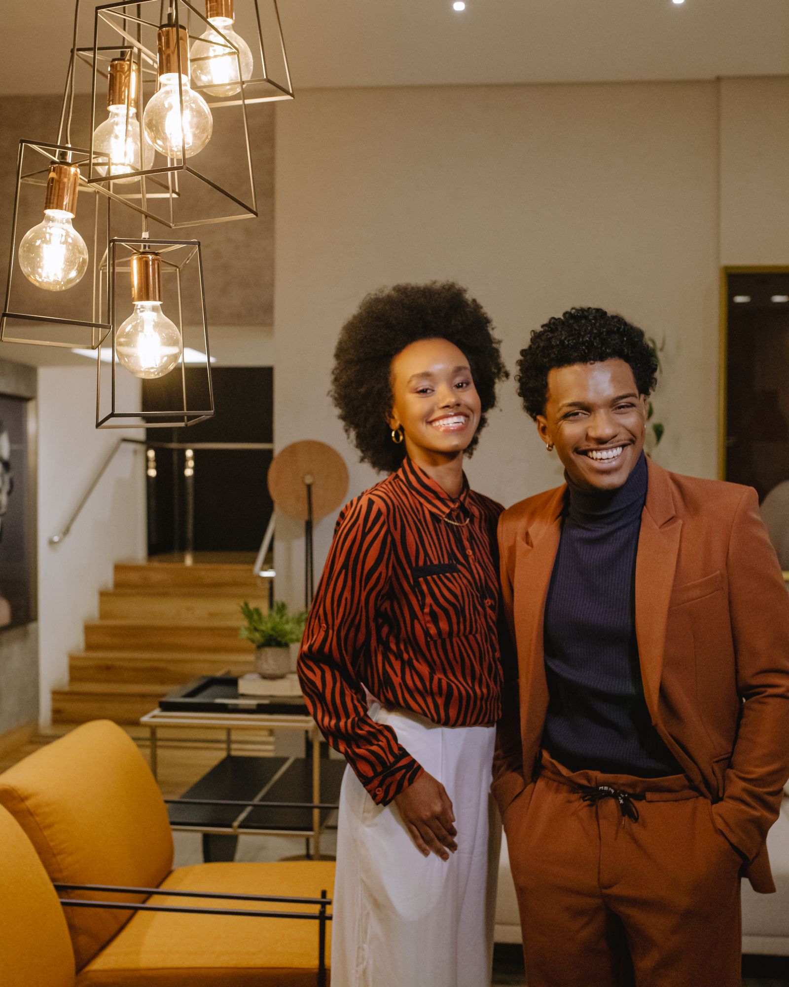 African couple enjoying a comfortable modern BnB interior