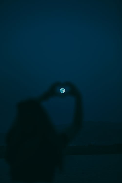 Free Full Moon Framed by Fingers in Heart Made with Fingers Stock Photo