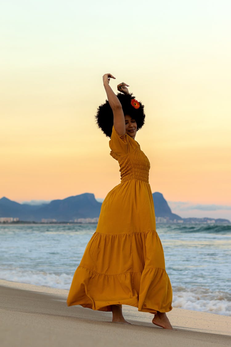 Woman Standing On A Beach 