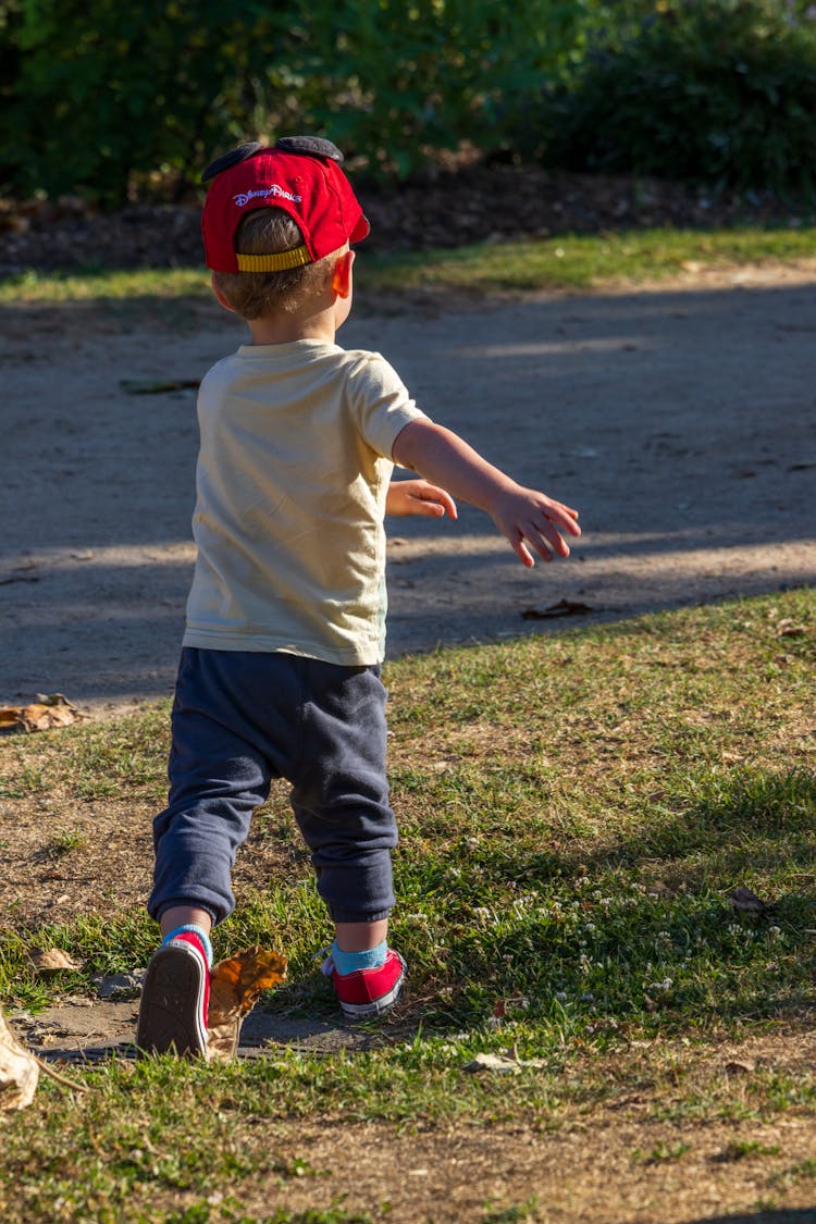 Boy Running On Lawn 