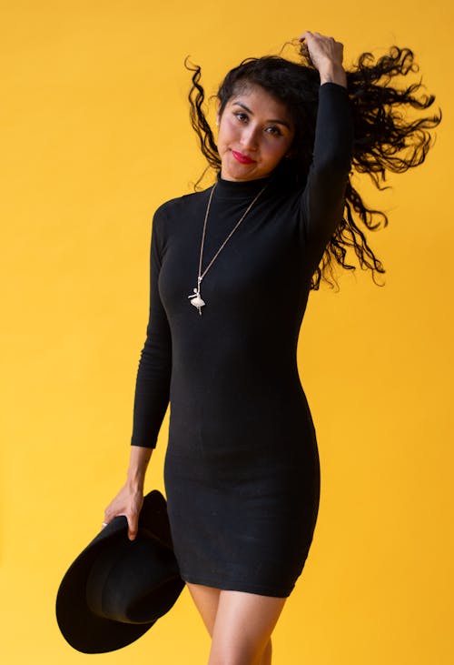 Woman in Black Mini Dress Tossing Hair