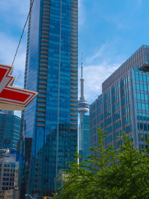 Free A vibrant view of Toronto's skyline featuring the iconic CN Tower and modern architecture. Stock Photo