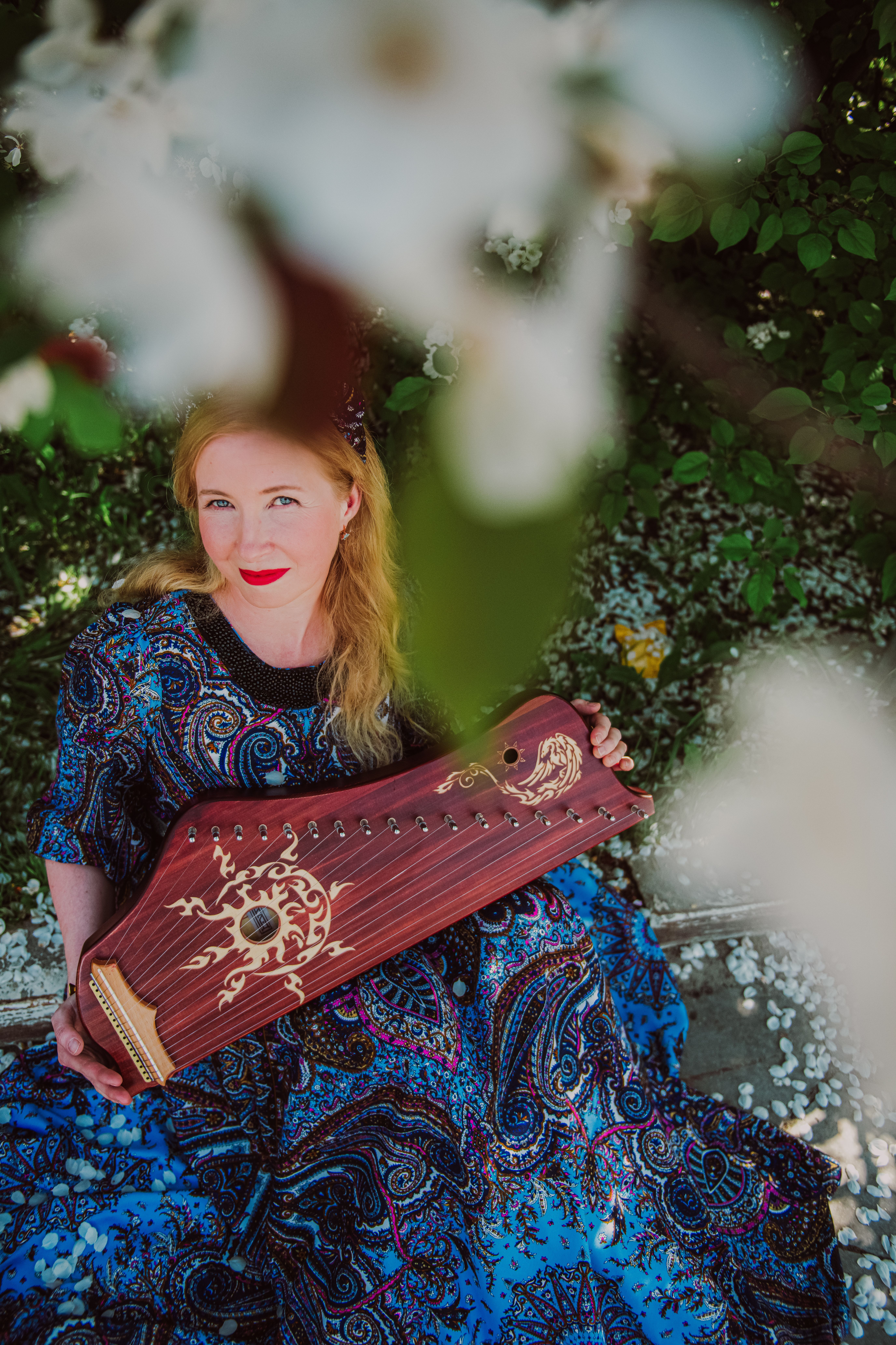 Woman Sitting with Traditional Music Instrument · Free Stock Photo