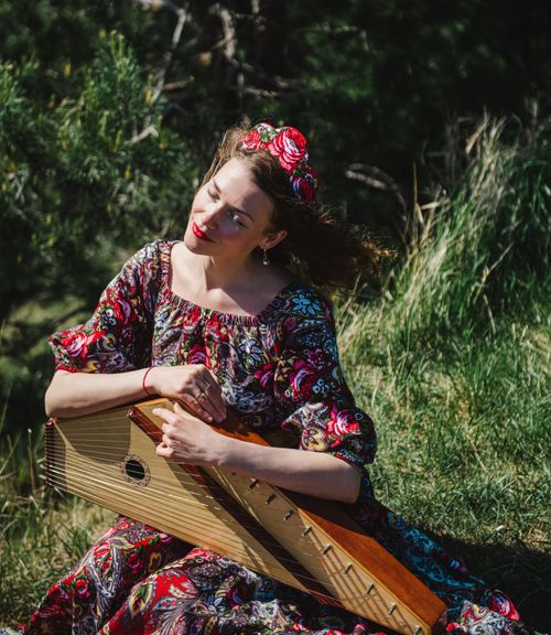 Women's Riding Instrument Women in Traditional Dresses Sitting with Traditional Music Instrument ...