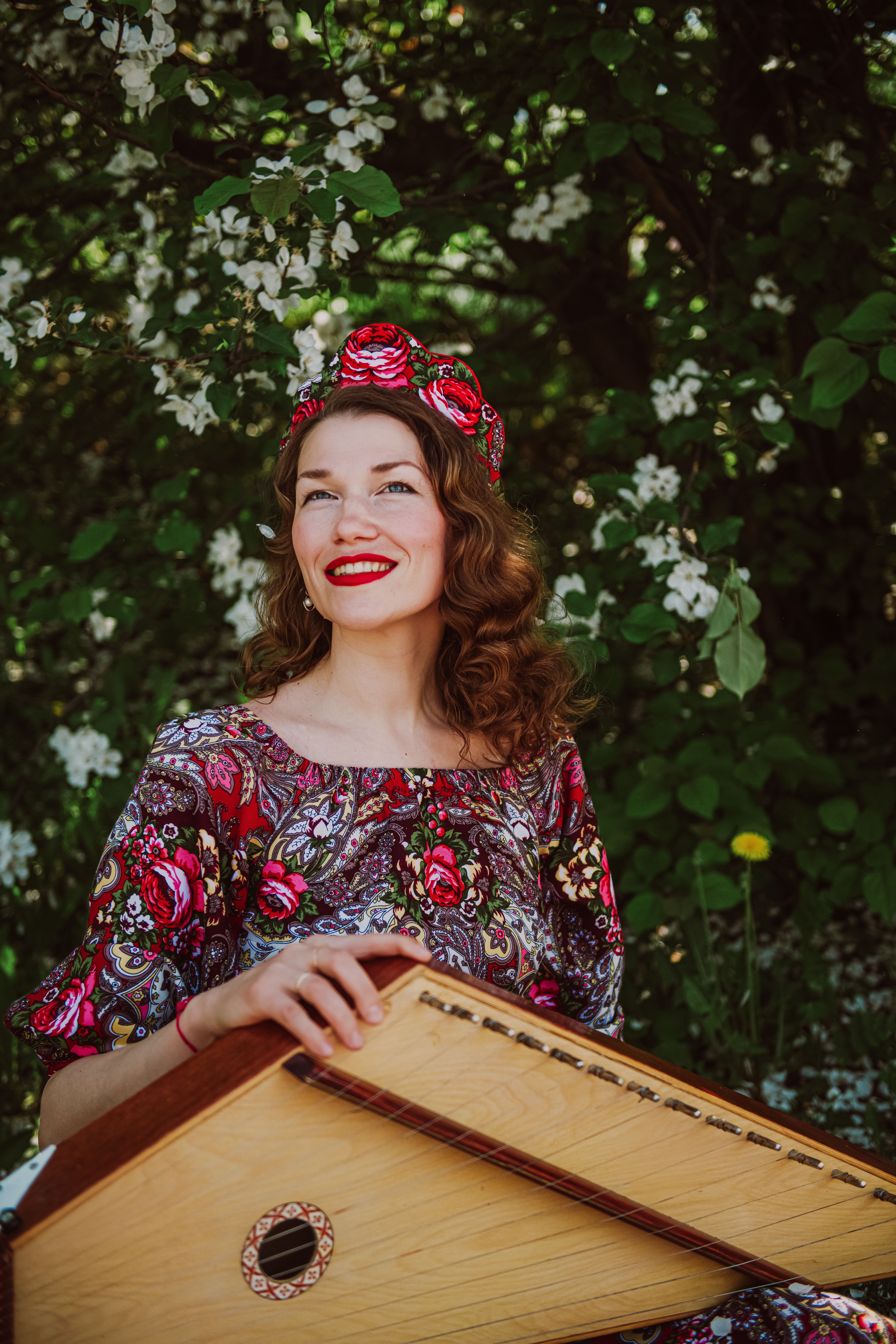 Smiling Woman with Traditional Music Instrument · Free Stock Photo