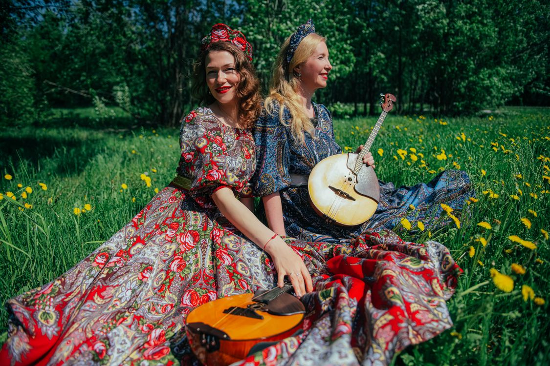 Women in Traditional Clothing and with Traditional Music Instruments on ...