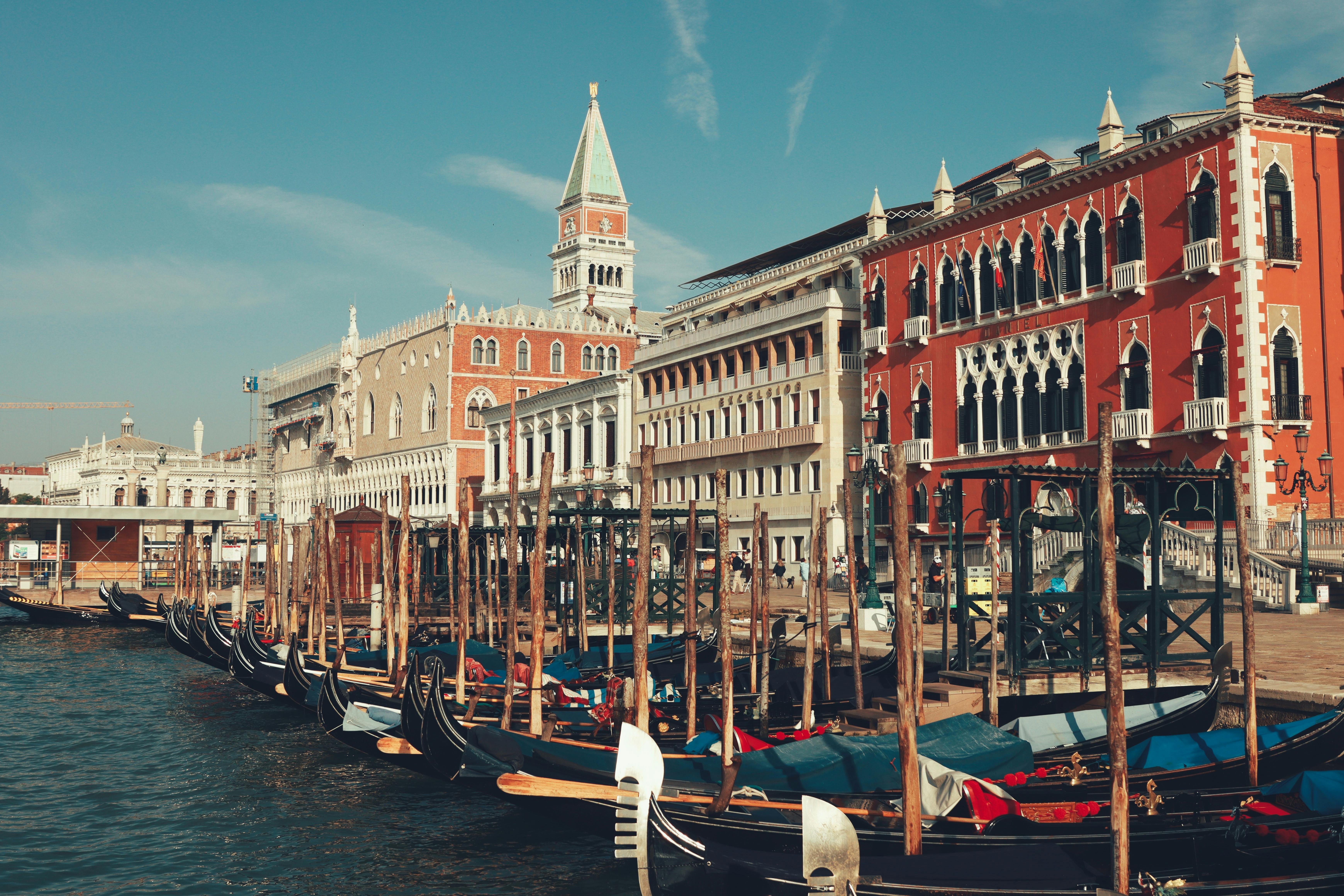 Gondolas on a serene Venetian canal at sunset