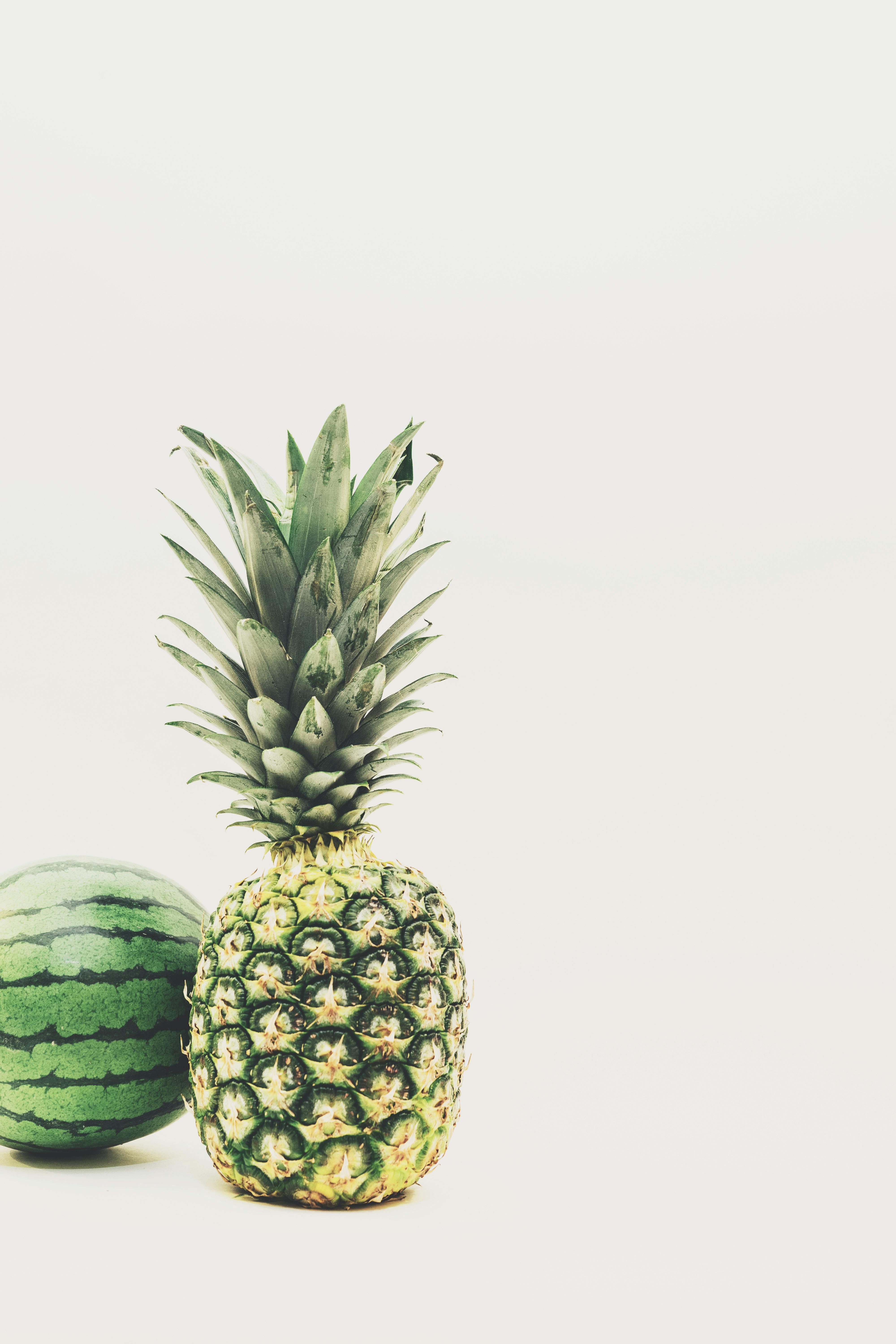 Photo of Green Pineapple and Watermelon Fruits Against White Background ·  Free Stock Photo
