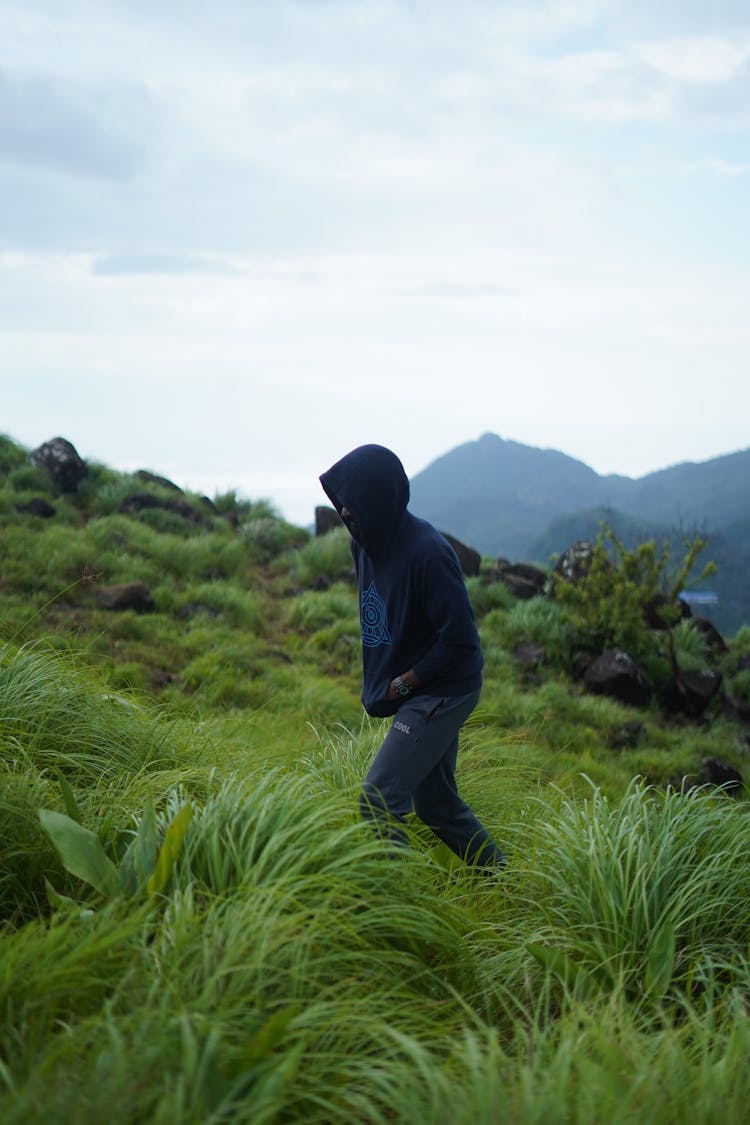 A Man Hiking In Mountains 