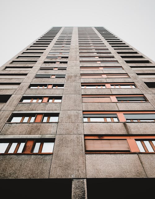 Low Angle Shot of a Tall Apartment Building in City 